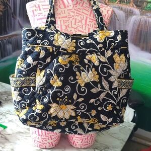 This is a beautiful black and yellow Vera Bradley diaper style bag.